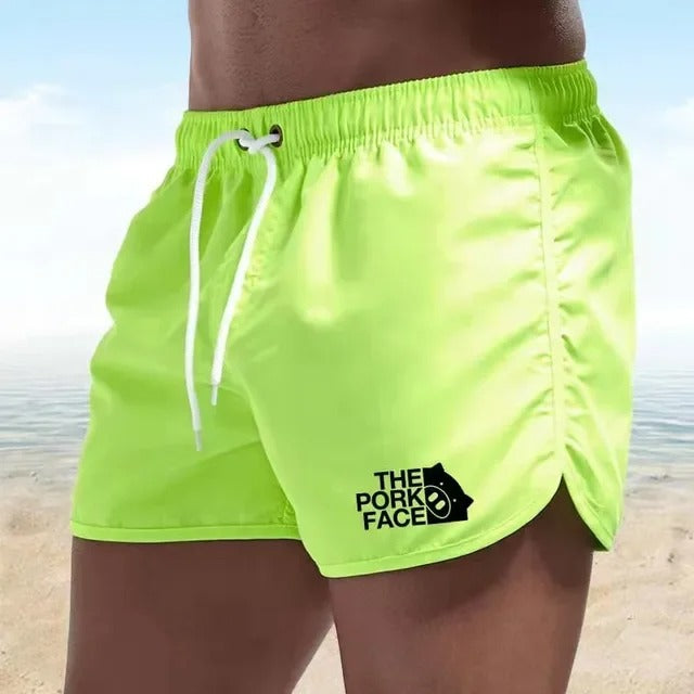 Adam - Atmungsaktive, tief ausgeschnittene Herren Badeshorts für den Strand