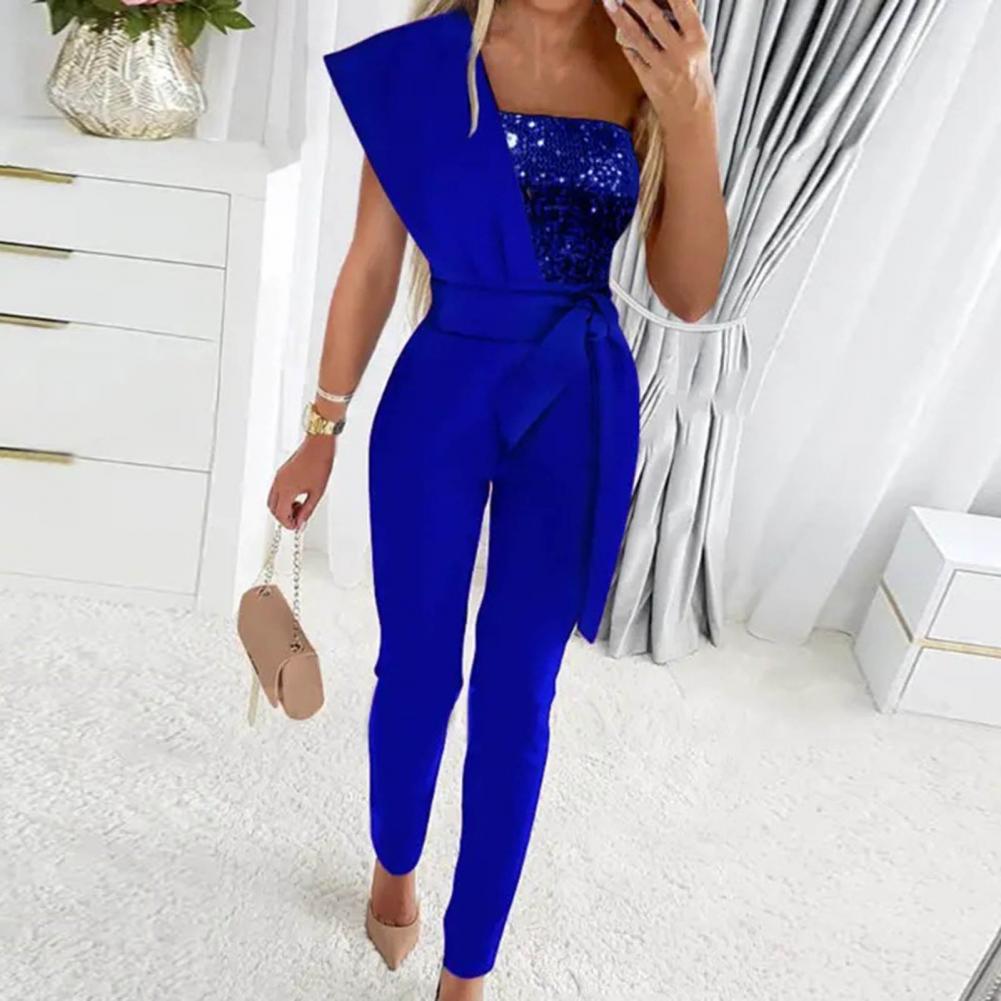 Moreira - Eleganter asymmetrischer halber Glitzer-Jumpsuit